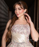 A luxurious evening gown in a pearl-toned ivory color with an elegant design
