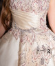 A luxurious evening gown in a pearl-toned ivory color with an elegant design