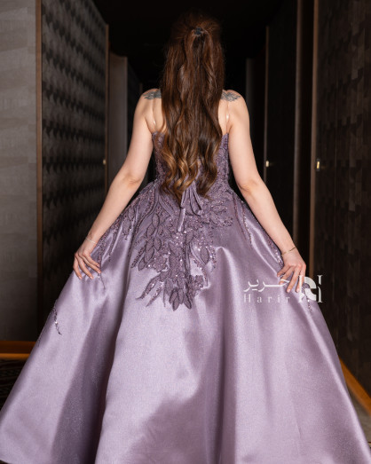 Embroidered purple evening gown with an elegant illusion neckline -