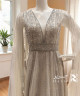 Elegant Off-White Evening Gown with Crystal Embellishments and Flowing Cape Sleeves Elegant Off-White Evening Gown with Crystal Embellishments and Flowing Cape Sleeves