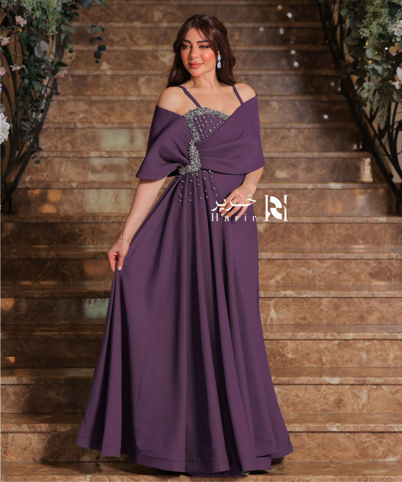 Elegant purple dress with crystal embroidery and off-shoulder design. Elegant purple dress with crystal embroidery and off-shoulder design.