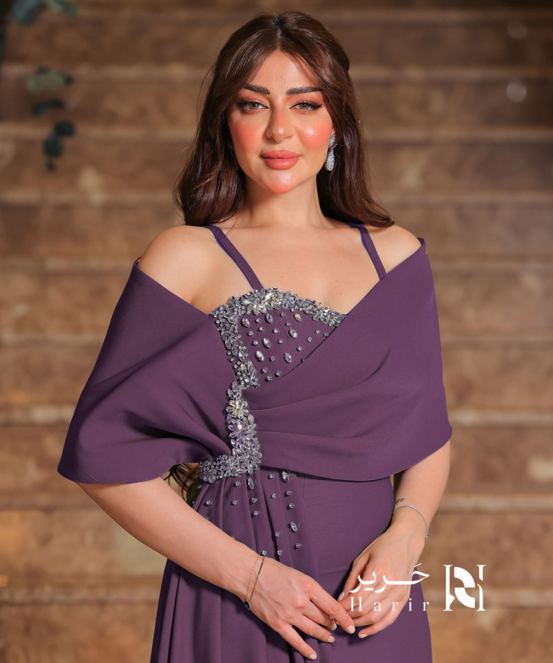 Elegant purple dress with crystal embroidery and off-shoulder design. Elegant purple dress with crystal embroidery and off-shoulder design.