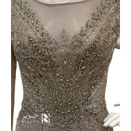 Elegant evening gown in a light gray color with a hint of lavender.      