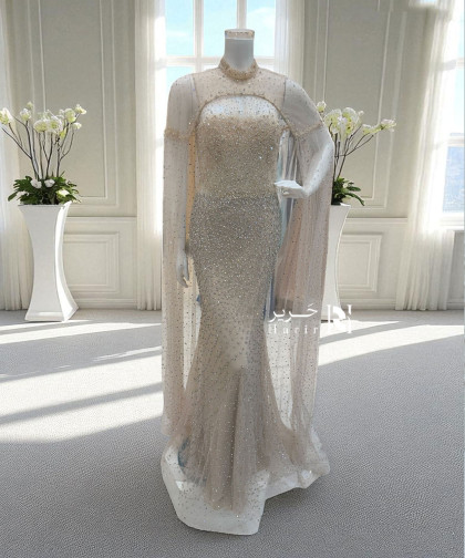 فستان سهرة بيج مطرّز بكاب لامع فخم