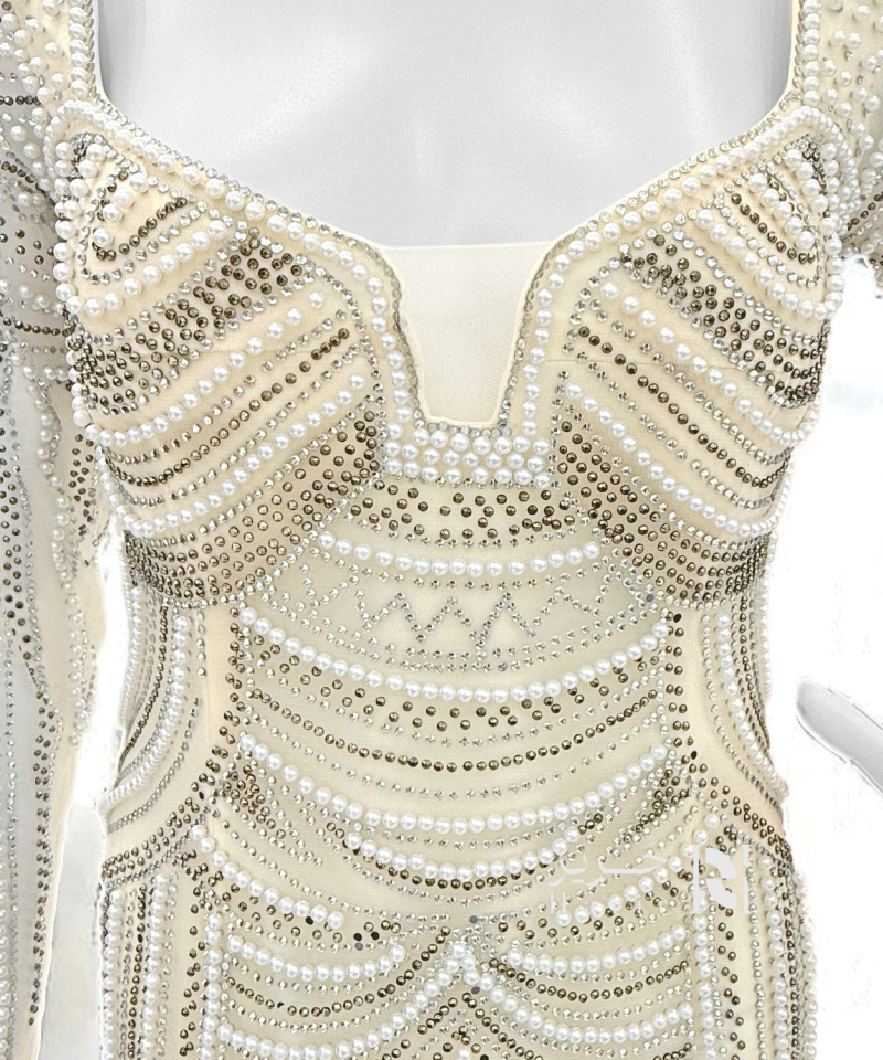 فستان سهرة عاجي بتطريز فاخر باللؤلؤ والكريستال