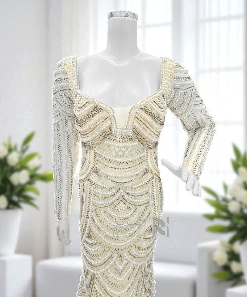 فستان سهرة عاجي بتطريز فاخر باللؤلؤ والكريستال