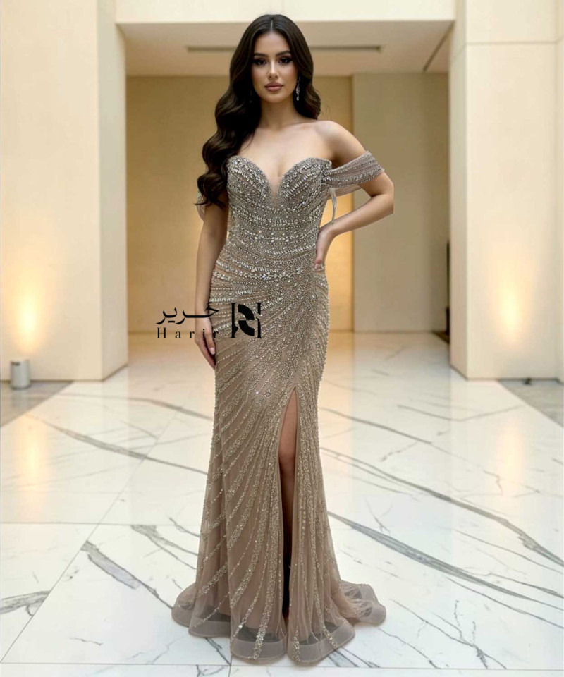 Champagne off-shoulder mermaid evening dress with crystal beaded embroidery and side slit.