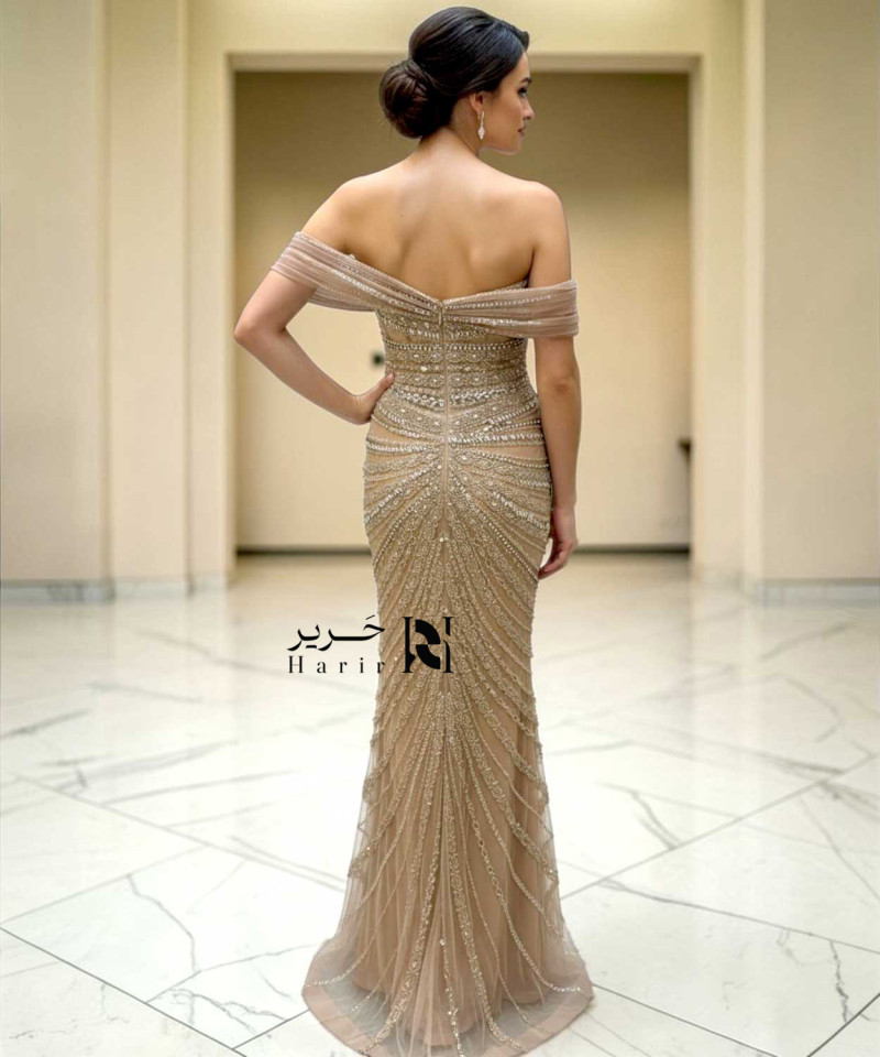 Champagne off-shoulder mermaid evening dress with crystal beaded embroidery and side slit.