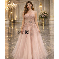 Blush nude strapless sweetheart evening dress with floral beaded corset and layered tulle skirt.