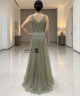 Olive green one-shoulder evening dress with beaded embroidery and side tulle drape.