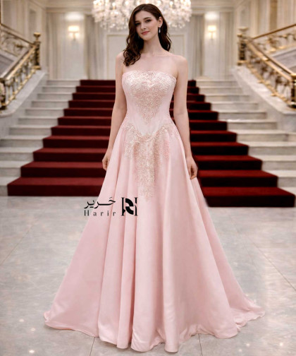 فستان سهرة وردي شامبين بتصميم كورسيه مطرّز فاخر وتنورة واسعة