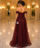 Luxury burgundy evening dress with shimmering embellishments and off-shoulder sleeves