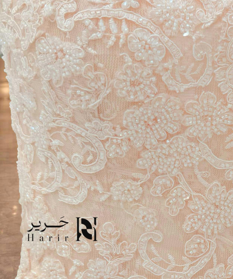 Soft pink evening dress with a sweetheart design and luxurious embroidery