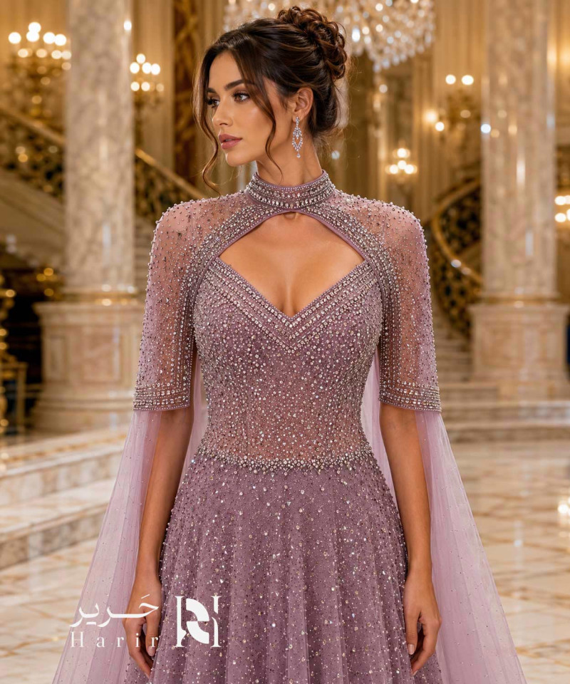 فستان سهرة موف ترابي منفوش بكاب شفاف وياقة عالية مطرز بالكريستال