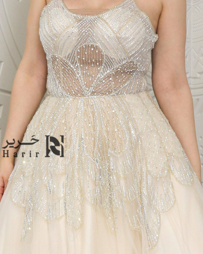 Cream Layered Tulle Dress with Sparkling Embroidery and Thin Straps. -