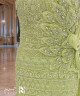 فستان سهرة أخضر فستقي مطرز بالخرز والكريستال بقصة كتف واحد وكاب جانبي
